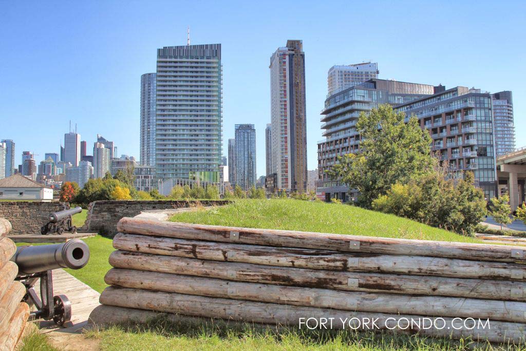 Fortifications and cannon at Fort York with condo buildings behind