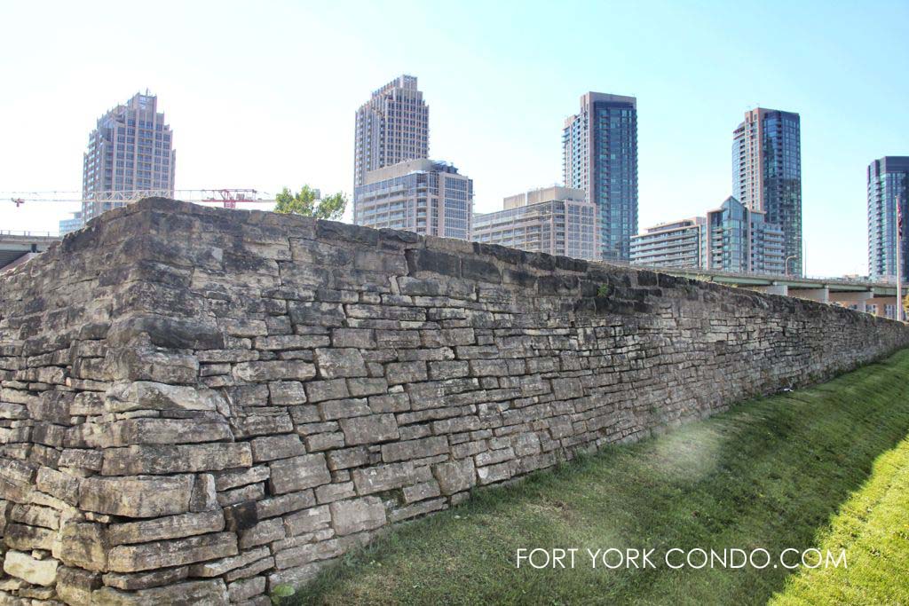 Stone Wall of historic Fort York in front of Fort York Condos